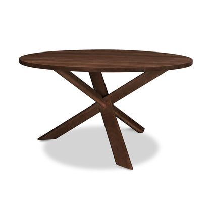 Junction Solid Top Table by Lyndon Furniture with round solid wood top, natural finish, and distinctive three angled legs.