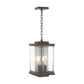 Kingston Outdoor Large Lantern by Hubbardton Forge with square bronze frame, clear glass panels, and two candle bulbs, showcasing elegant American-made craftsmanship.