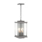 Kingston Outdoor Large Lantern by Hubbardton Forge with clear glass panels, metal frame, and two candle bulbs suspended inside the lantern.