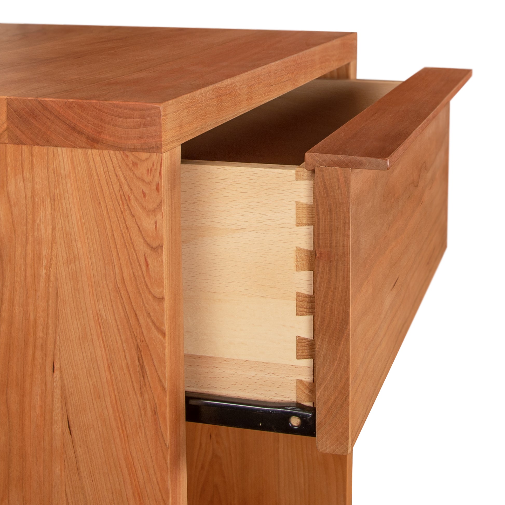 A wooden Vermont Furniture Designs Kipling 1-Drawer Enclosed Shelf Nightstand partially opened, revealing dovetail joint construction in a natural cherry finish.
