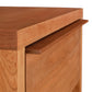 A close up of a Vermont Furniture Designs Kipling 1-Drawer Enclosed Shelf Nightstand, made from natural wood, perfect for fine furniture lovers.