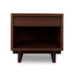 A Vermont Furniture Designs Kipling 1-Drawer Enclosed Shelf Wide Nightstand, natural wood furniture piece with an open drawer and an empty shelf, isolated on a white background.