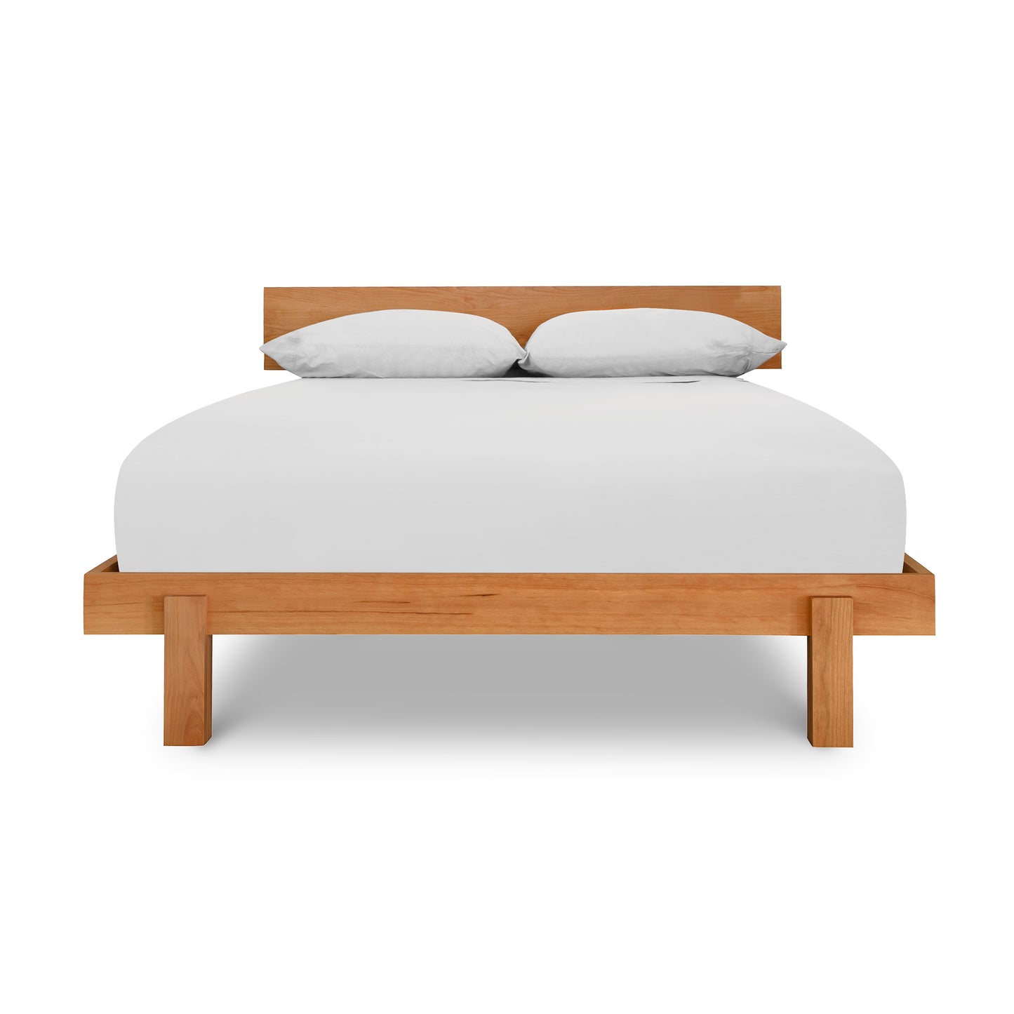 Description: A Kipling Bed by Vermont Furniture Designs, made of solid wood with white sheets on a platform.