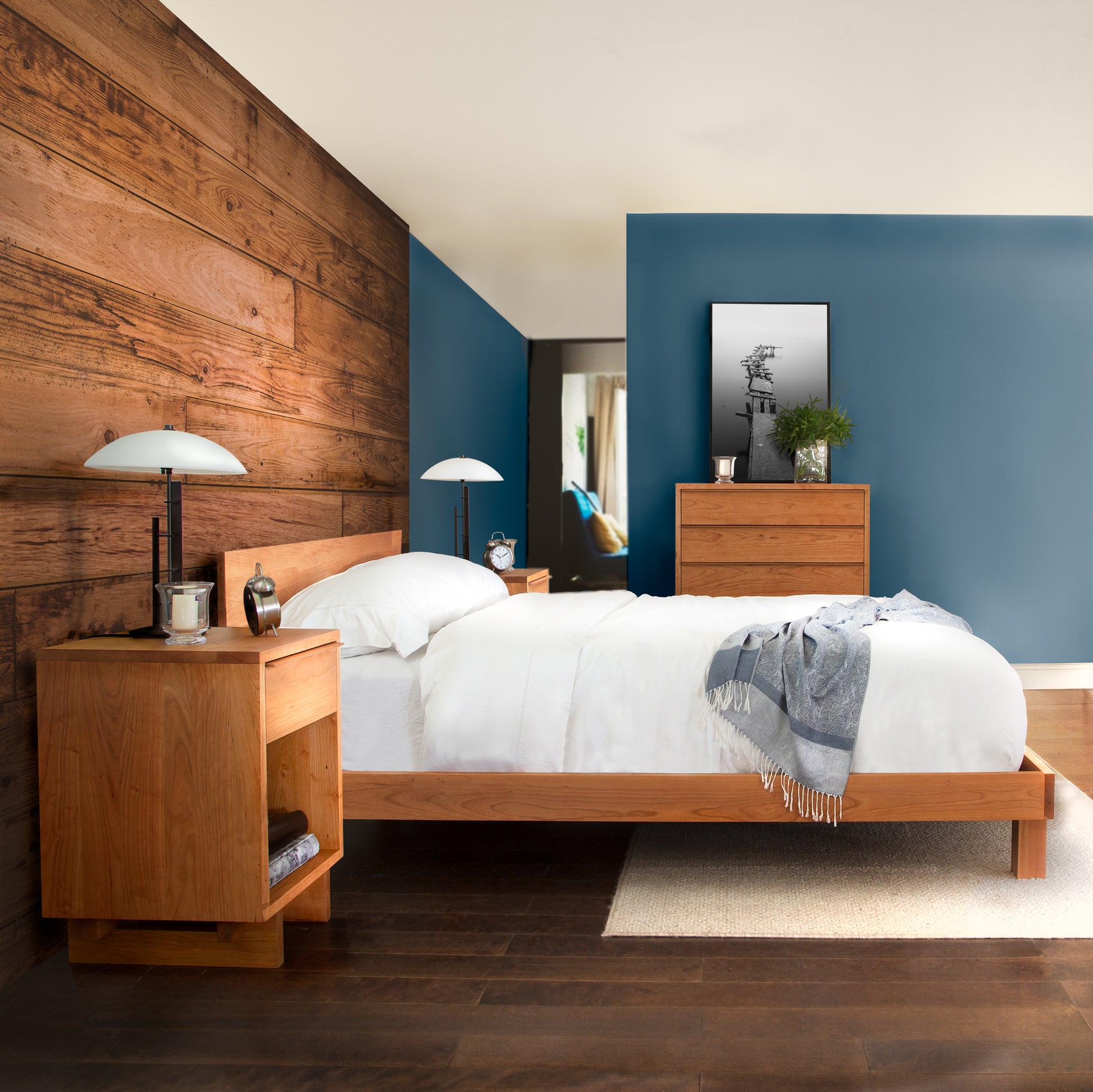 A bedroom with blue walls and Vermont Furniture Designs Kipling Bed.