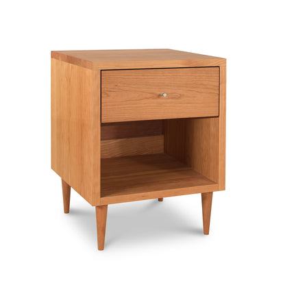 Vermont Furniture Designs Larssen Nightstand in hardwood with 1 drawer, shelf, and tapered legs, featuring a smooth finish.