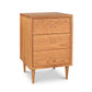 A Vermont Furniture Designs Larssen 3-Drawer Nightstand, crafted from natural hardwoods, stands on angled legs against a white background.