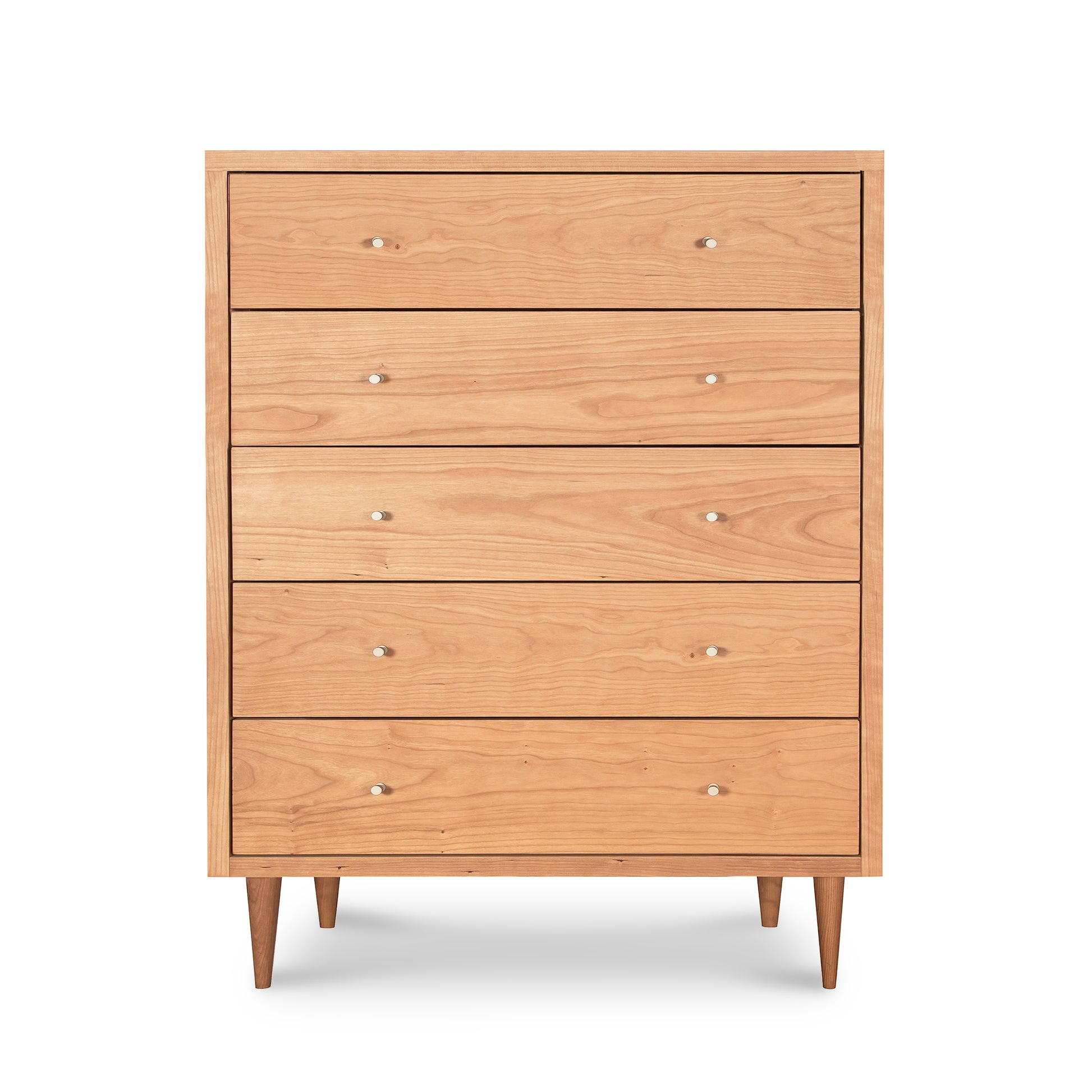 A mid-century modern, natural cherry Larssen 5-Drawer Wide Chest with round knobs and angled legs isolated on a white background by Vermont Furniture Designs.