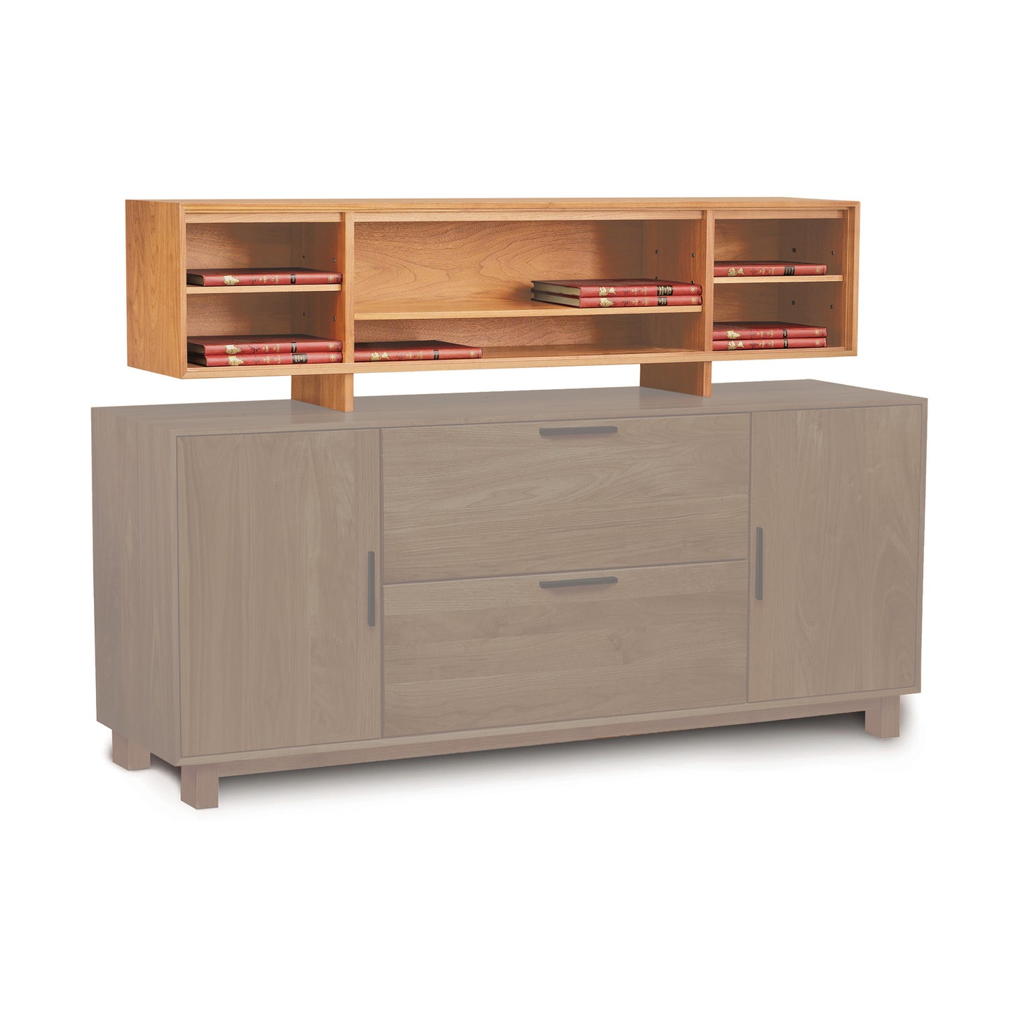 The Linear Office Organizer by Copeland Furniture features a versatile design with a lower section in light gray that includes two central drawers flanked by cabinets, and an upper section in natural wood color with open shelves, each holding several books.