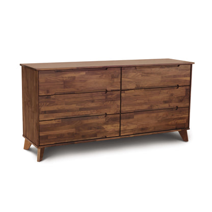 Linn 6-Drawer Dresser by Copeland Furniture, showcasing mid-century style with angled legs and a natural wood finish highlighting intricate grain patterns.