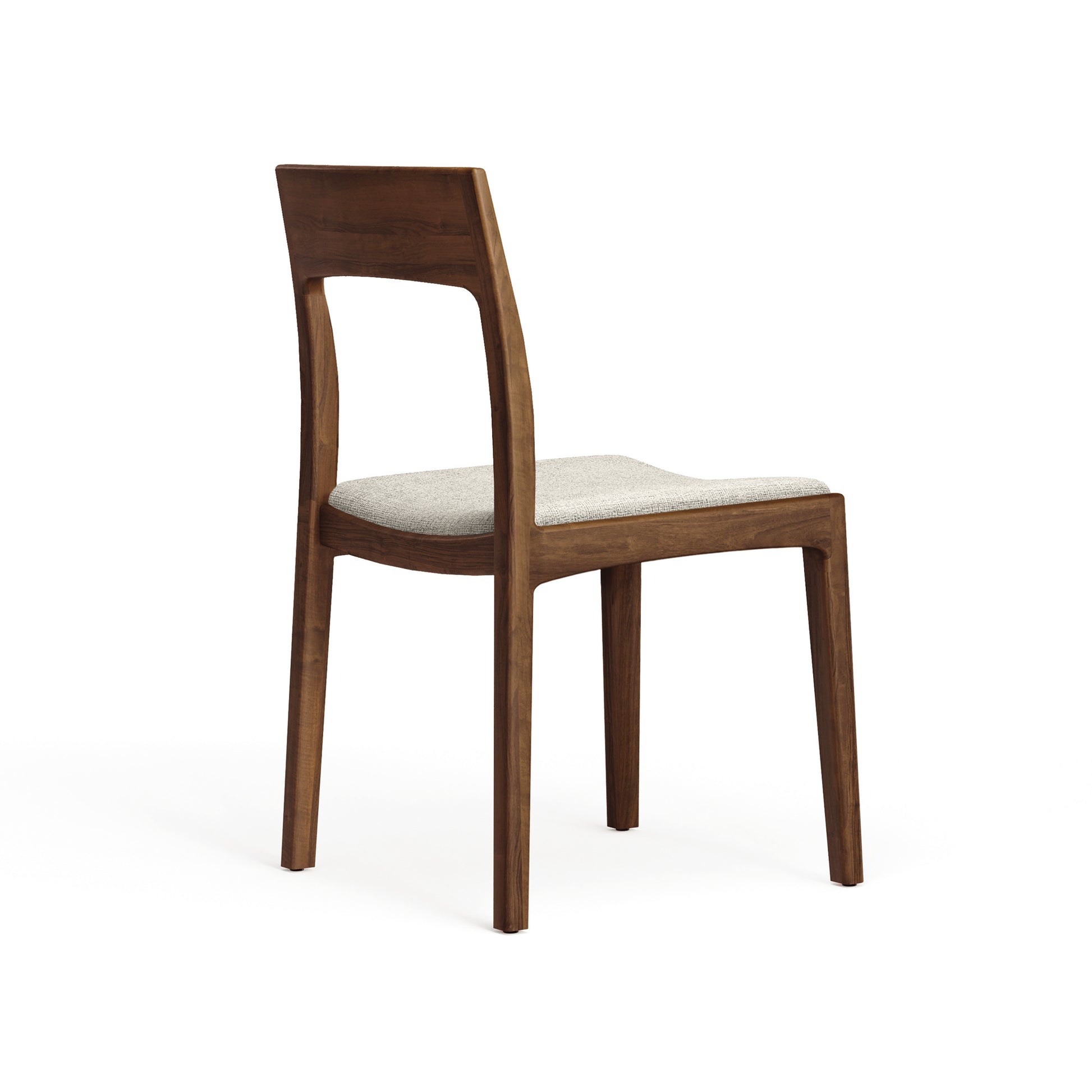 Lisse Dining Chair by Copeland Furniture features a handcrafted wood frame, rectangular backrest, and light cushion upholstery.