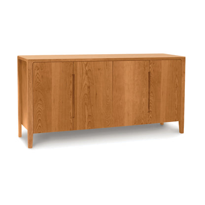 Lisse Buffet by Copeland Furniture with four doors, minimalist handles, natural wood finish, and short legs. American made, artisan-crafted design.