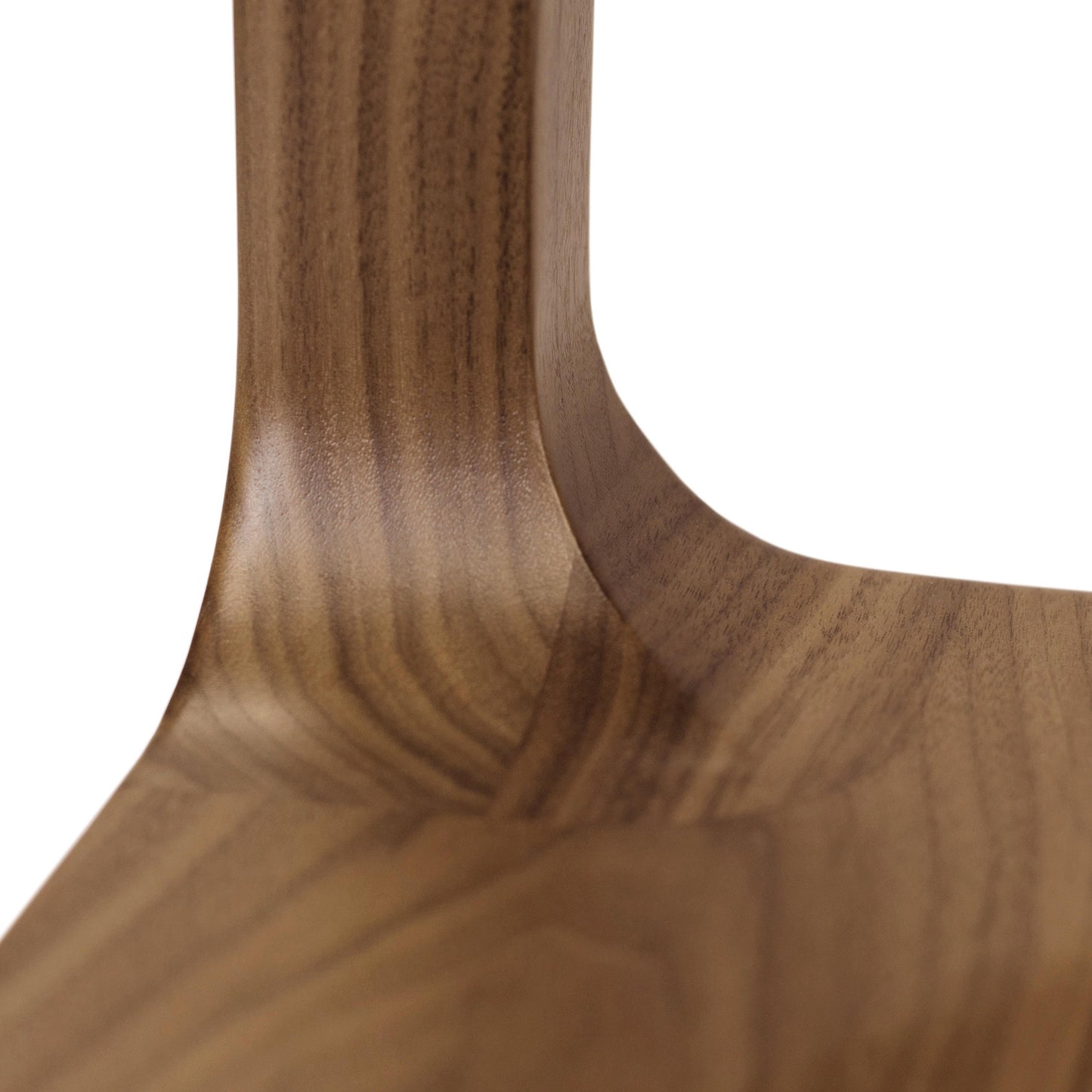 A close up view of a walnut dining table.