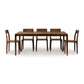 Minimalist walnut Lisse Extension Dining Table with six chairs by Copeland Furniture.