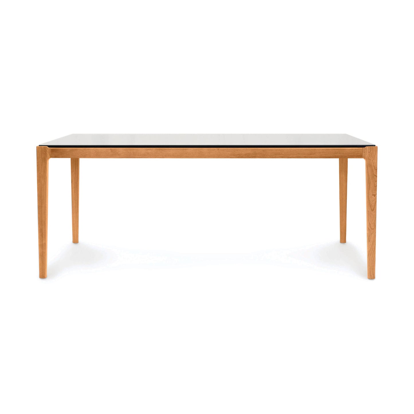 Copeland Furniture Lisse Glass Top Dining Table with minimalist design, sleek light brown legs, and a smooth glass surface, American made craftsmanship.