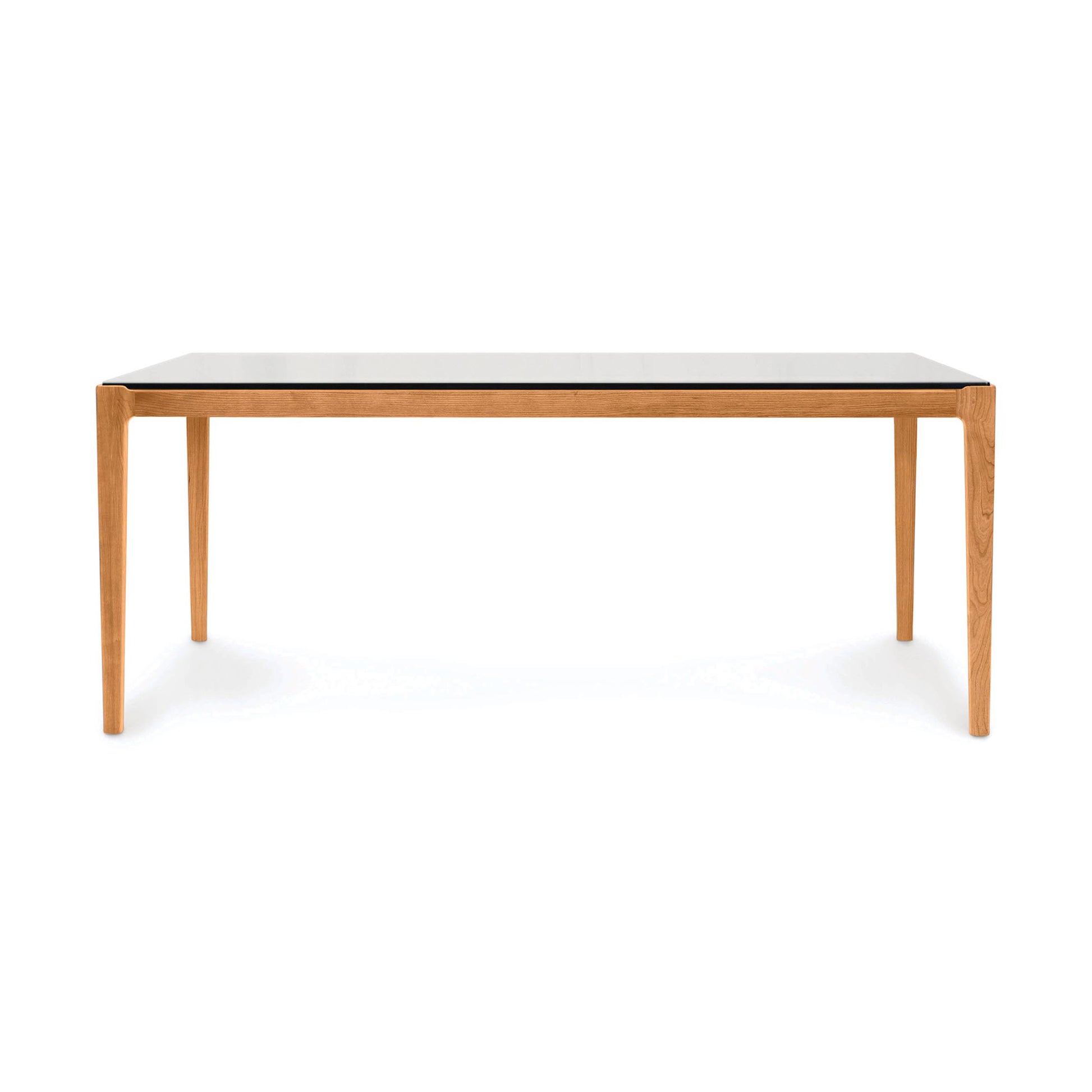 Copeland Furniture Lisse Glass Top Dining Table with minimalist design, sleek light brown legs, and a smooth glass surface, American made craftsmanship.