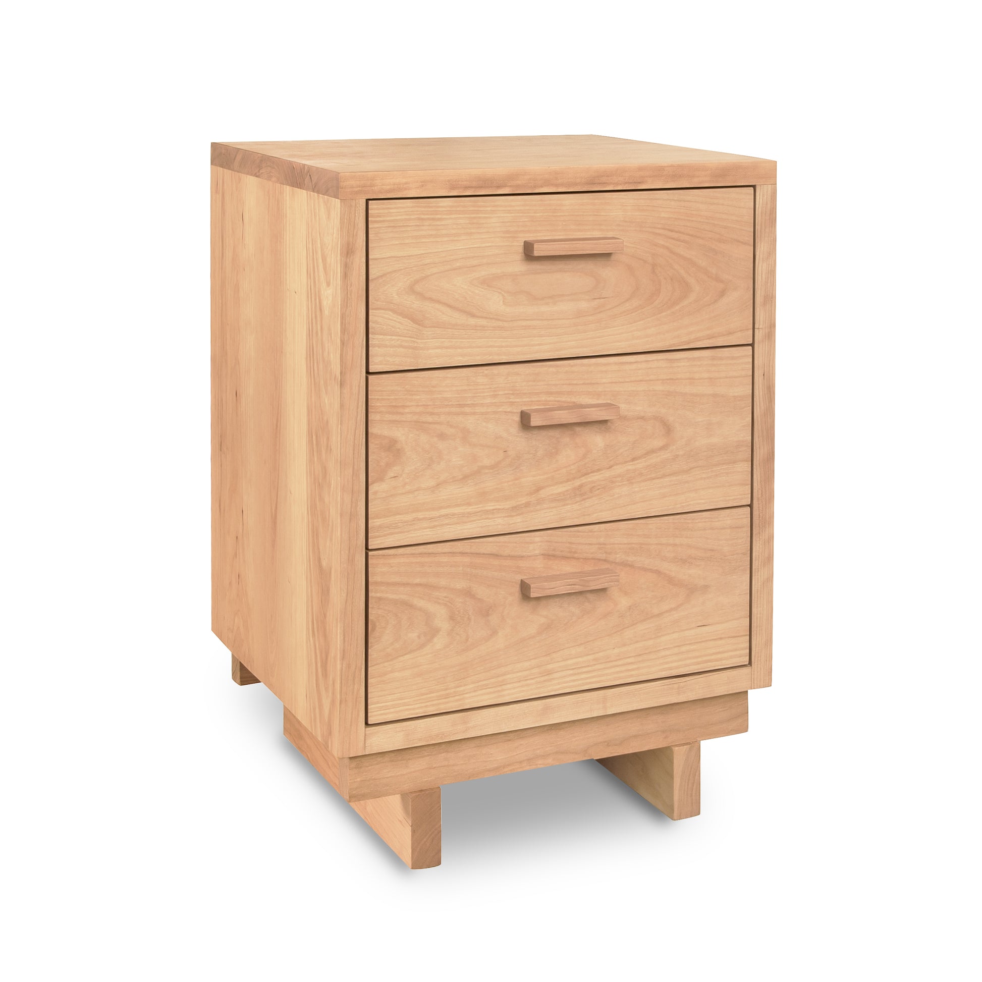 A Loft 3-Drawer Nightstand by Vermont Furniture Designs, a solid wood construction nightstand, isolated on a white background.