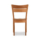 A wooden dining chair on a white background.