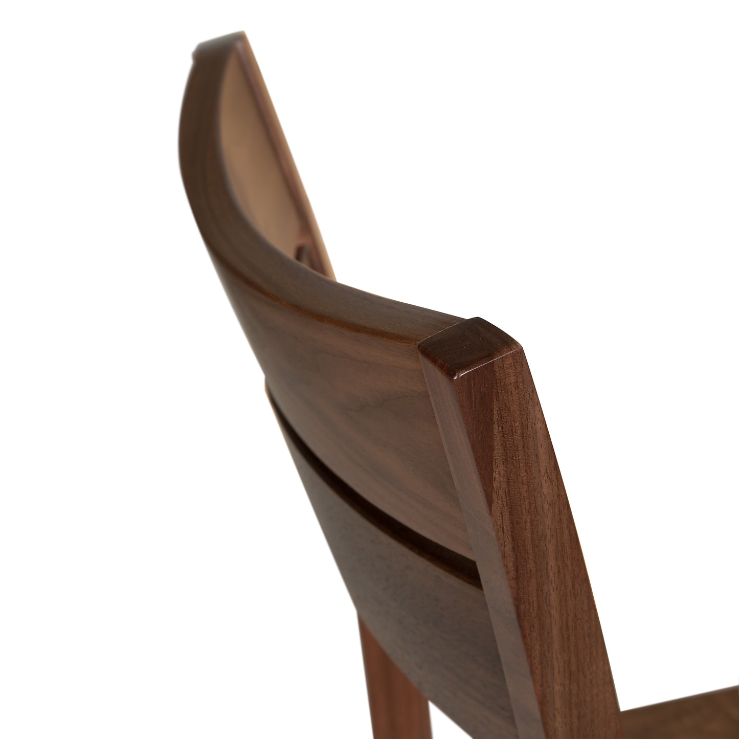 A close up view of a wooden chair.