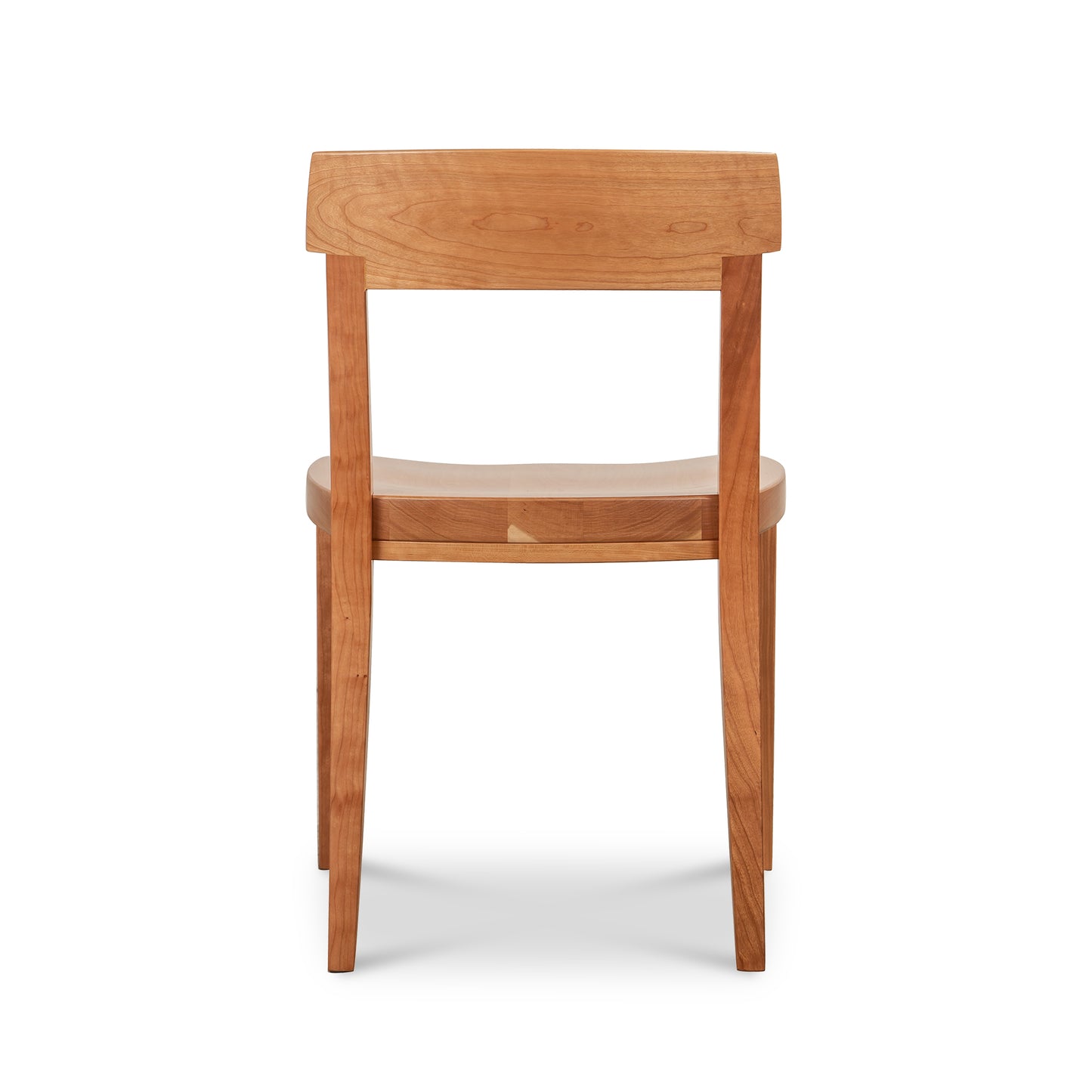 Vermont Woods Studios Ludlow Chair crafted in natural wood with a gently curved backrest and seat, shown from the back to highlight its artisanal design.