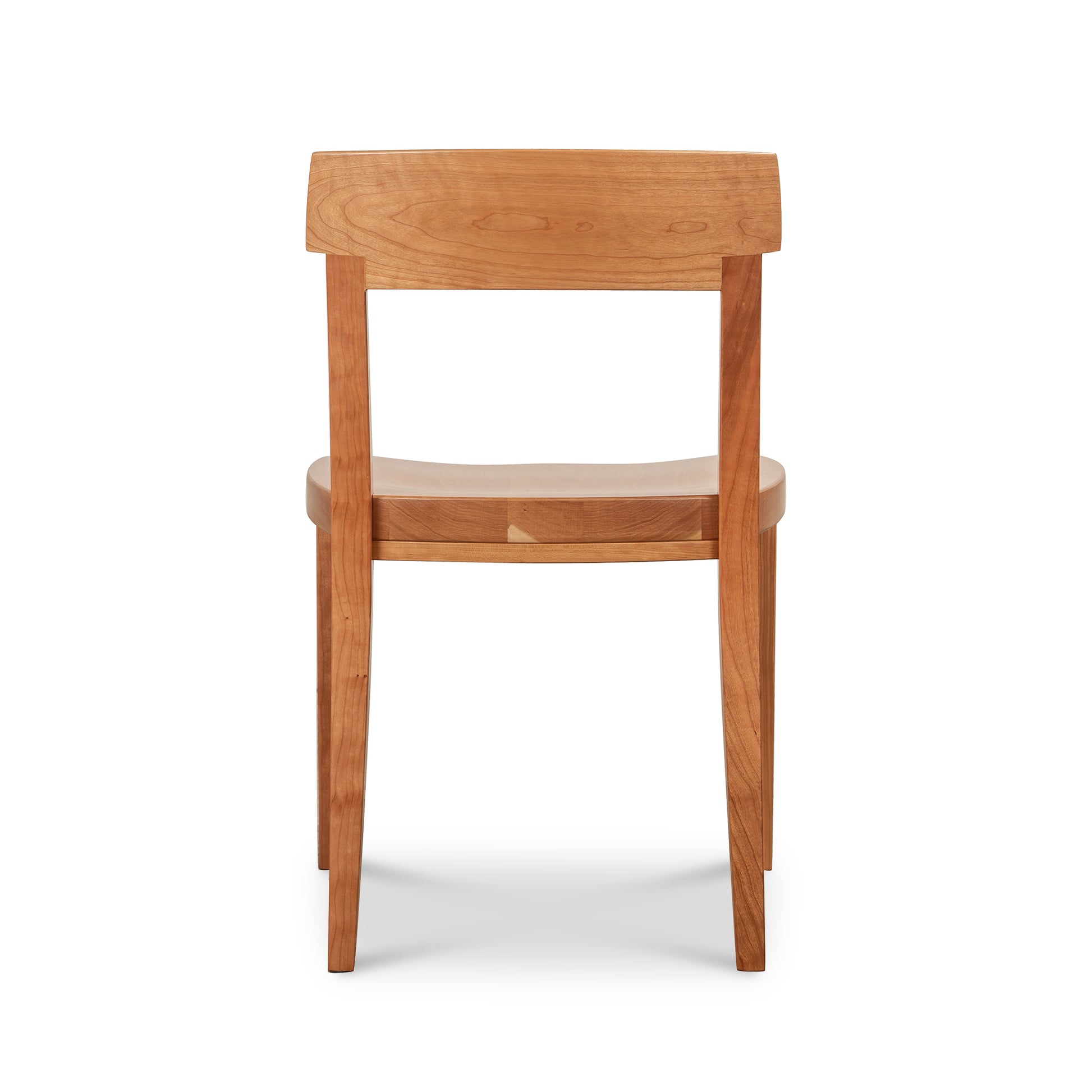 Vermont Woods Studios Ludlow Chair crafted in natural wood with a gently curved backrest and seat, shown from the back to highlight its artisanal design.