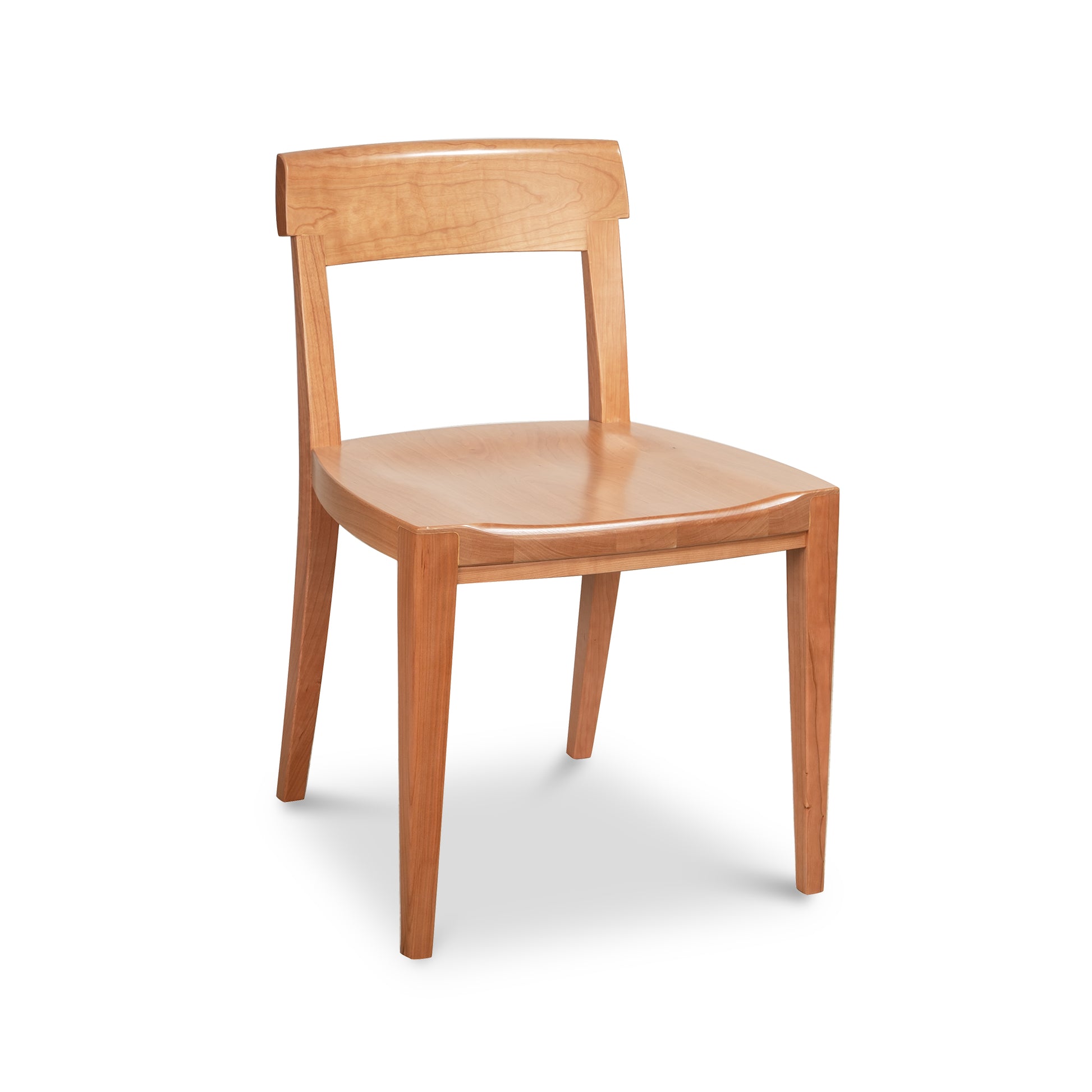 Vermont Woods Studios Ludlow Chair showcases premium natural wood, curved backrest, and sturdy straight legs, highlighting expert American craftsmanship.