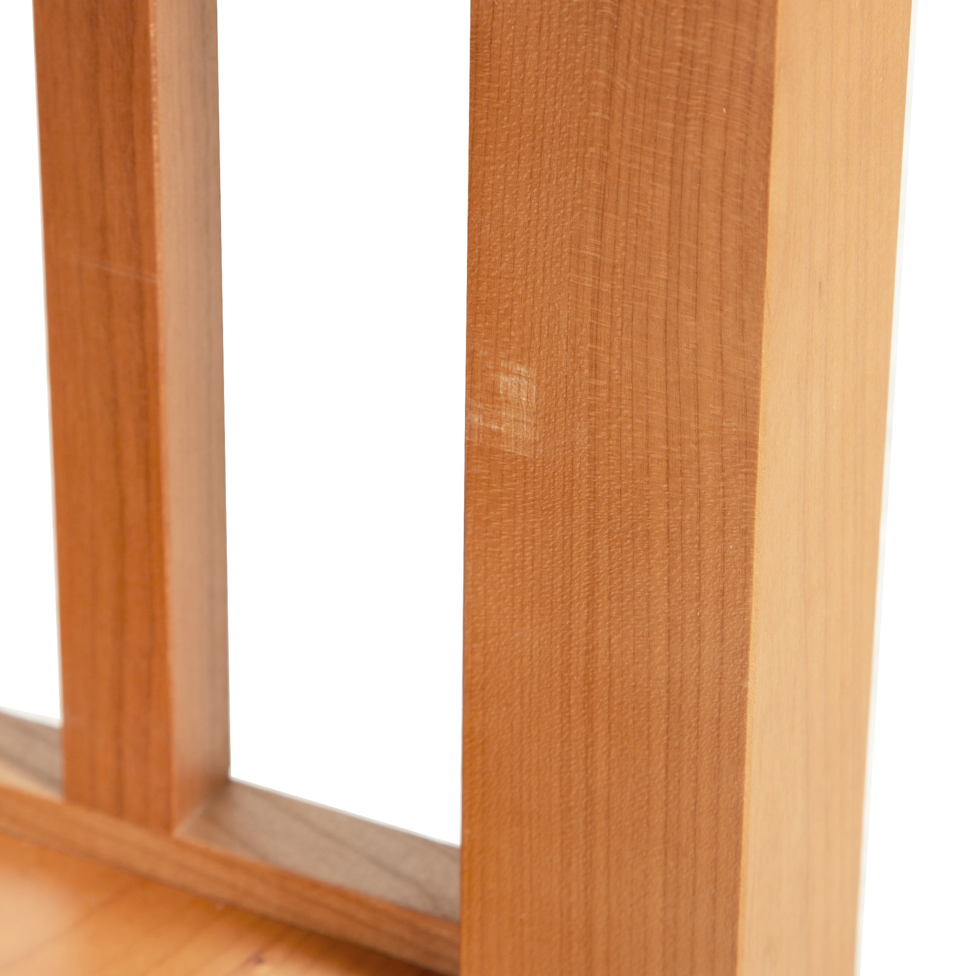 A close up of an American Mission End Table with Shelf - Clearance by Lyndon Furniture, handmade wooden shelf with a natural finish.