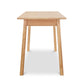 A small wooden table with legs on a white background.