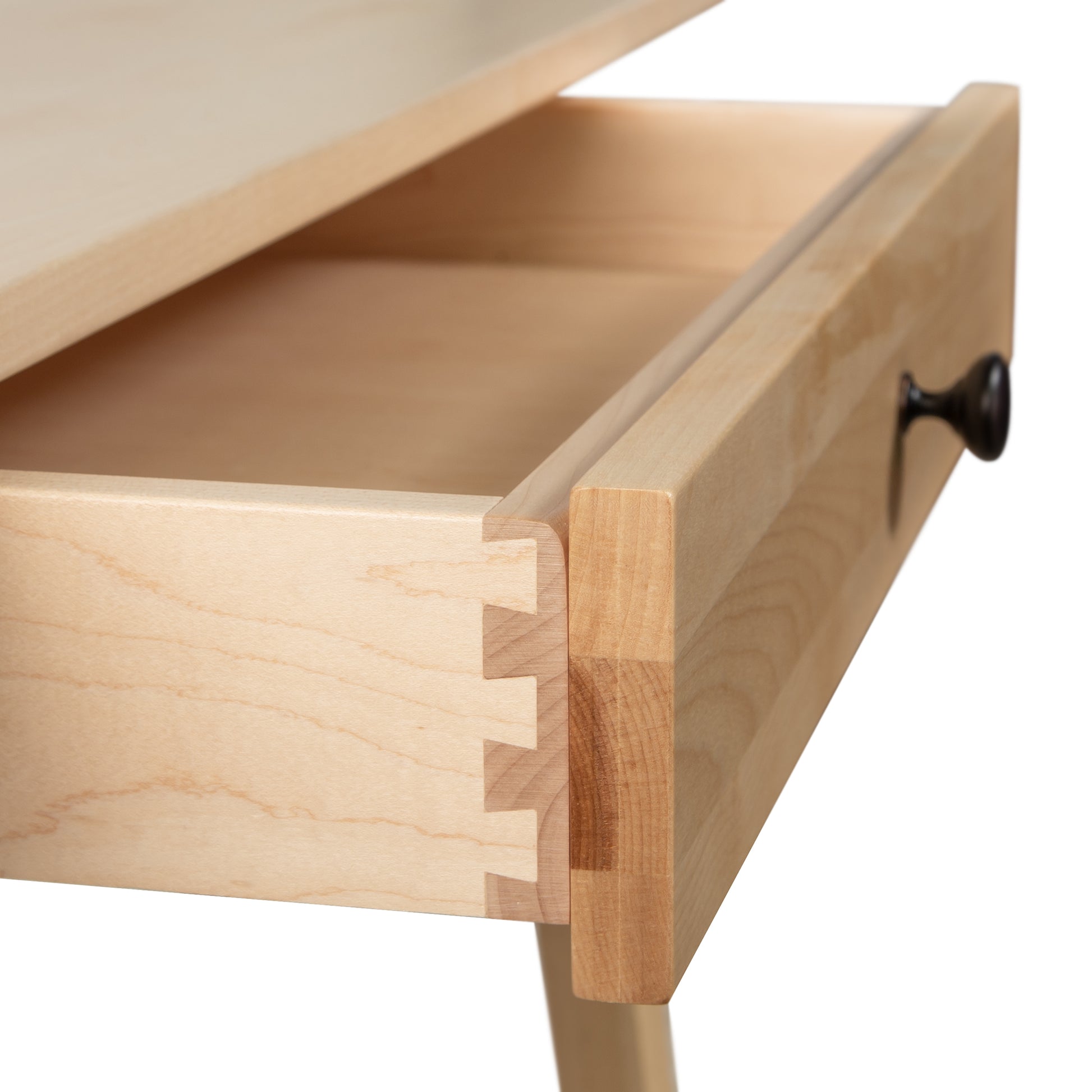A close up of a wooden desk with a drawer.