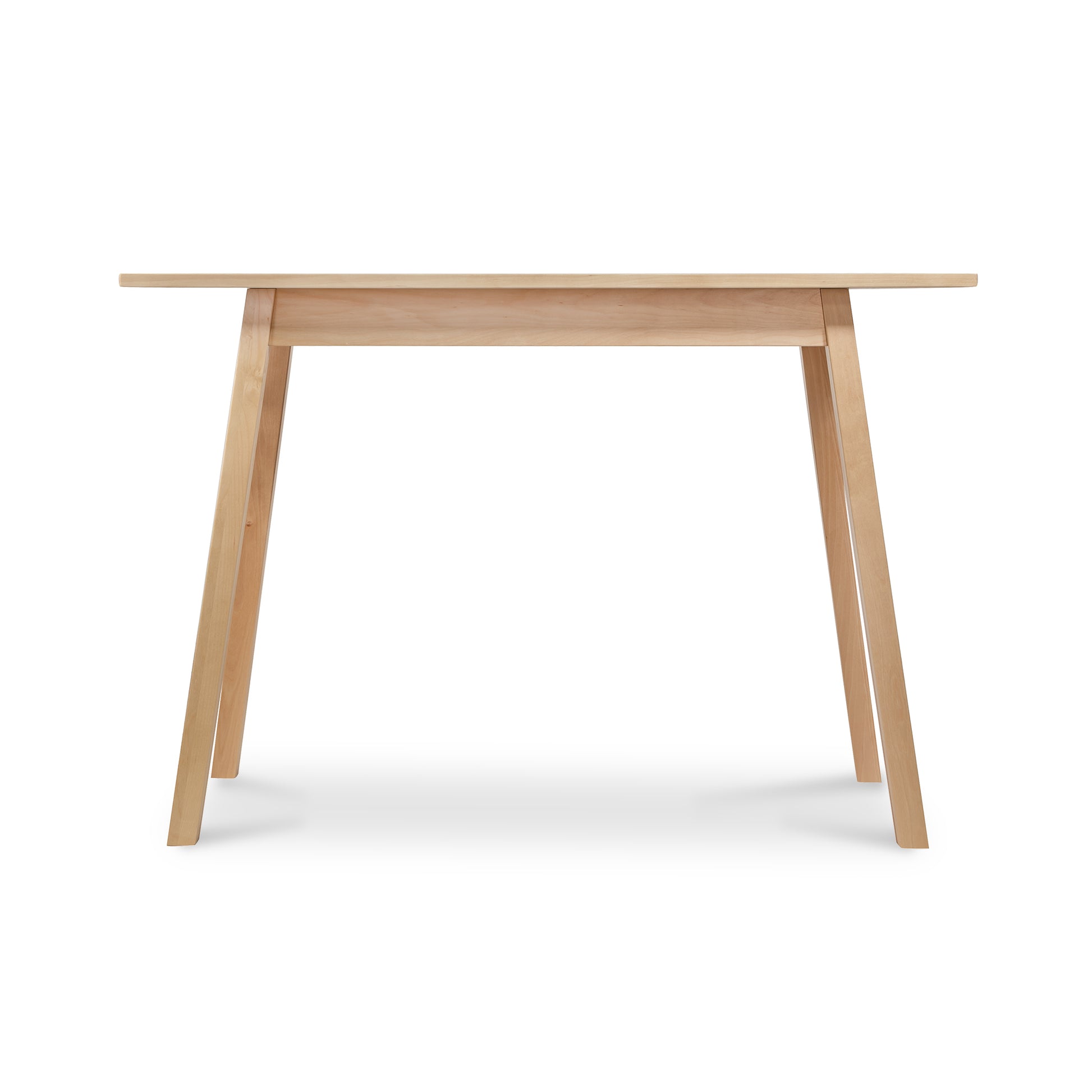 Manchester Compact Desk by Vermont Woods Studios, crafted from birch with four angled legs, front view highlighting fine American woodworking.