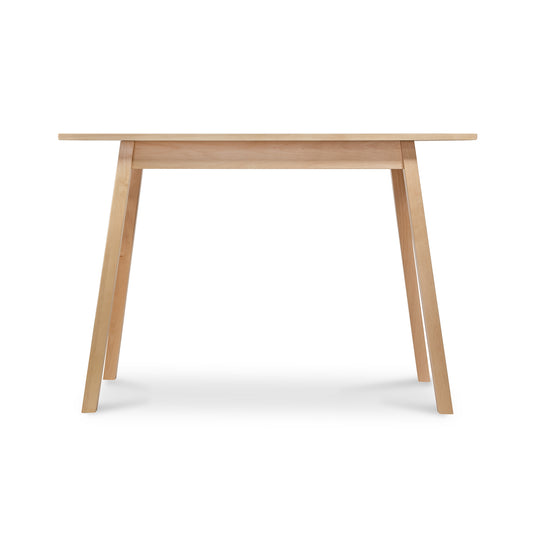 Manchester Compact Desk by Vermont Woods Studios, crafted from birch with four angled legs, front view highlighting fine American woodworking.