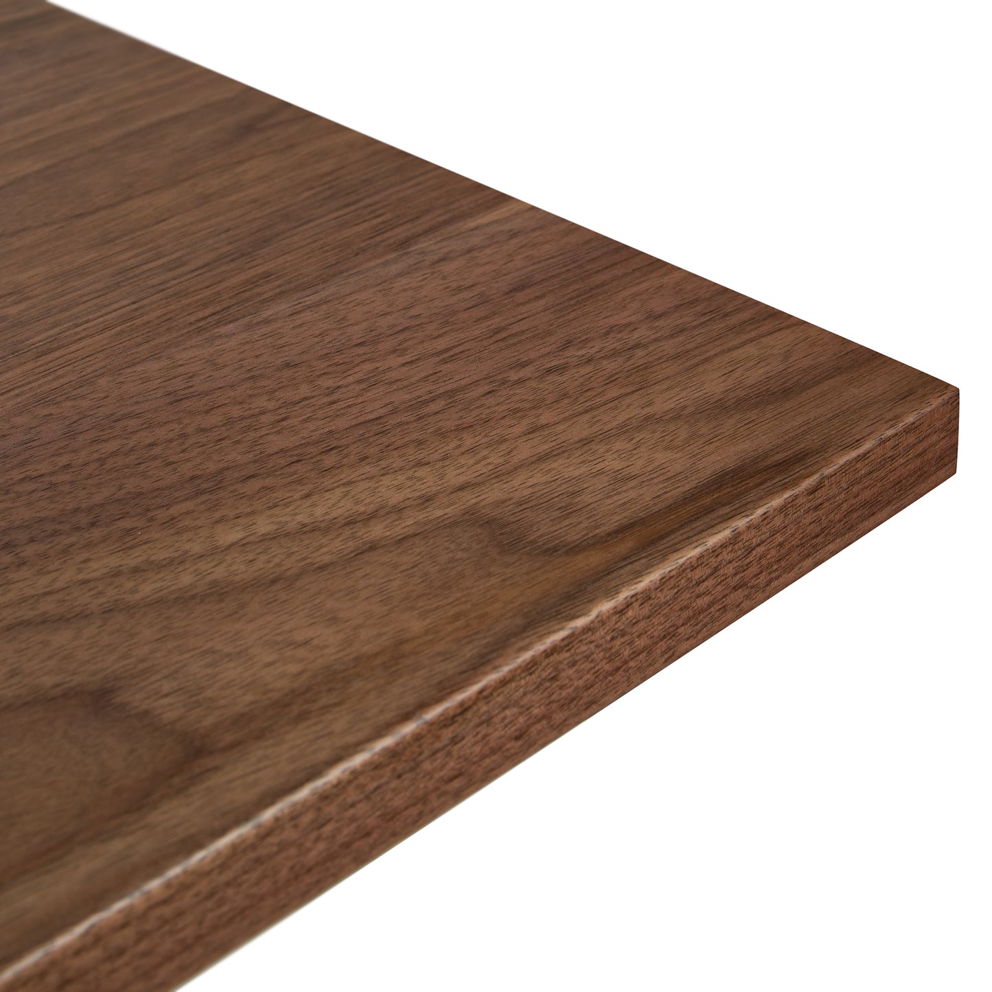 A close up view of a walnut table top.