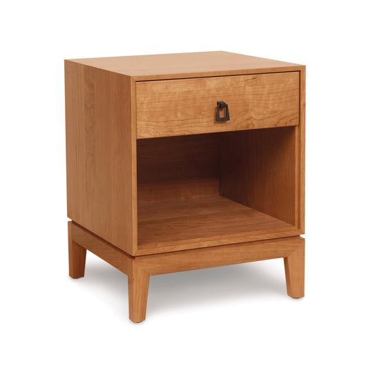 An organic solid wood nightstand with a drawer, appropriately named the Copeland Furniture Mansfield 1-Drawer Enclosed Shelf Nightstand.