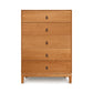 A solid natural wood Copeland Furniture Mansfield 5-Drawer Wide Chest dresser with simple handles, isolated against a white background.