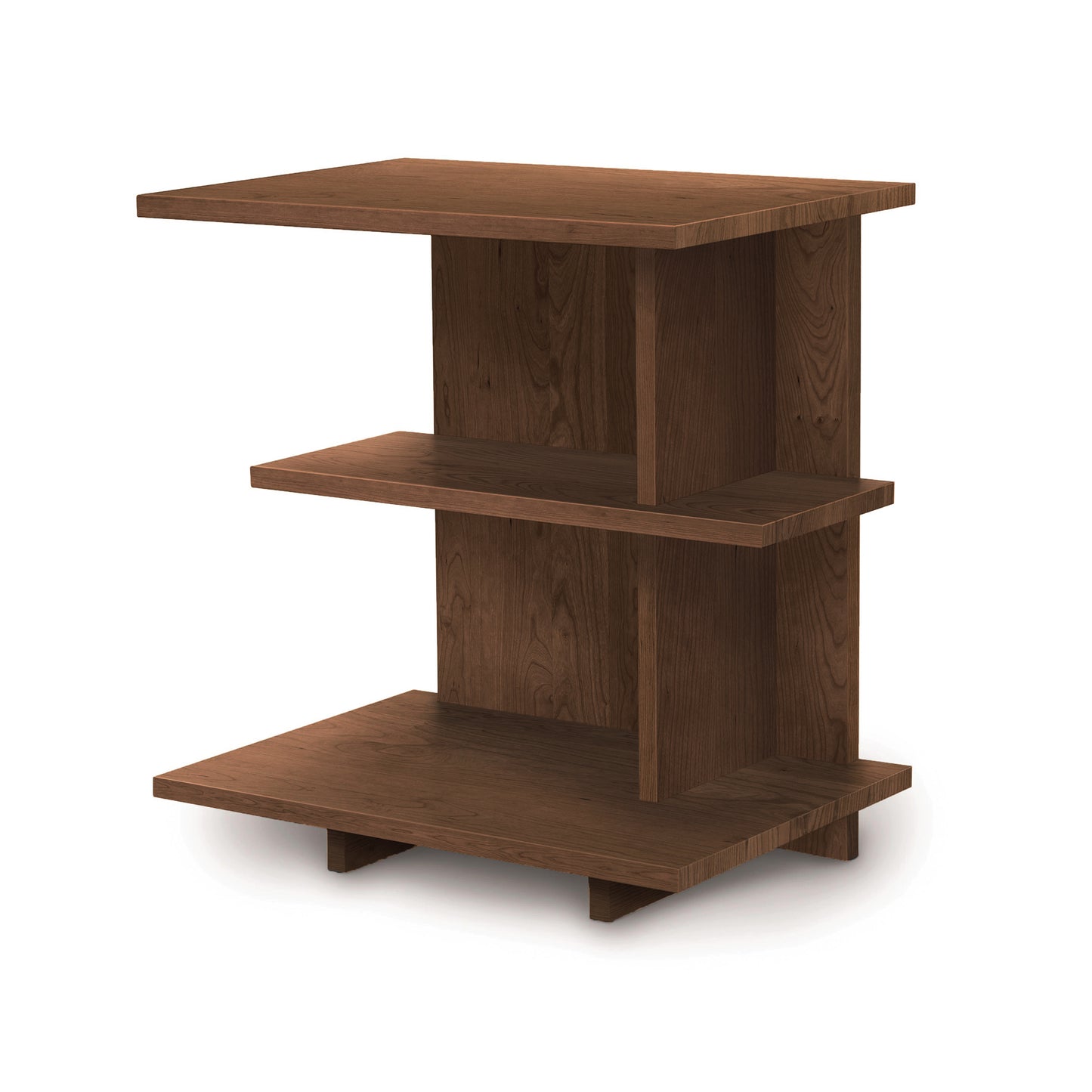 The Mansfield Open Shelf Nightstand by Copeland Furniture features a dark brown finish, reminiscent of cherry bedroom furniture, and includes three staggered rectangular shelves. The shelves vary in size, with the bottom being the largest and the top the smallest. Its vertical supports and open design enhance its functionality.