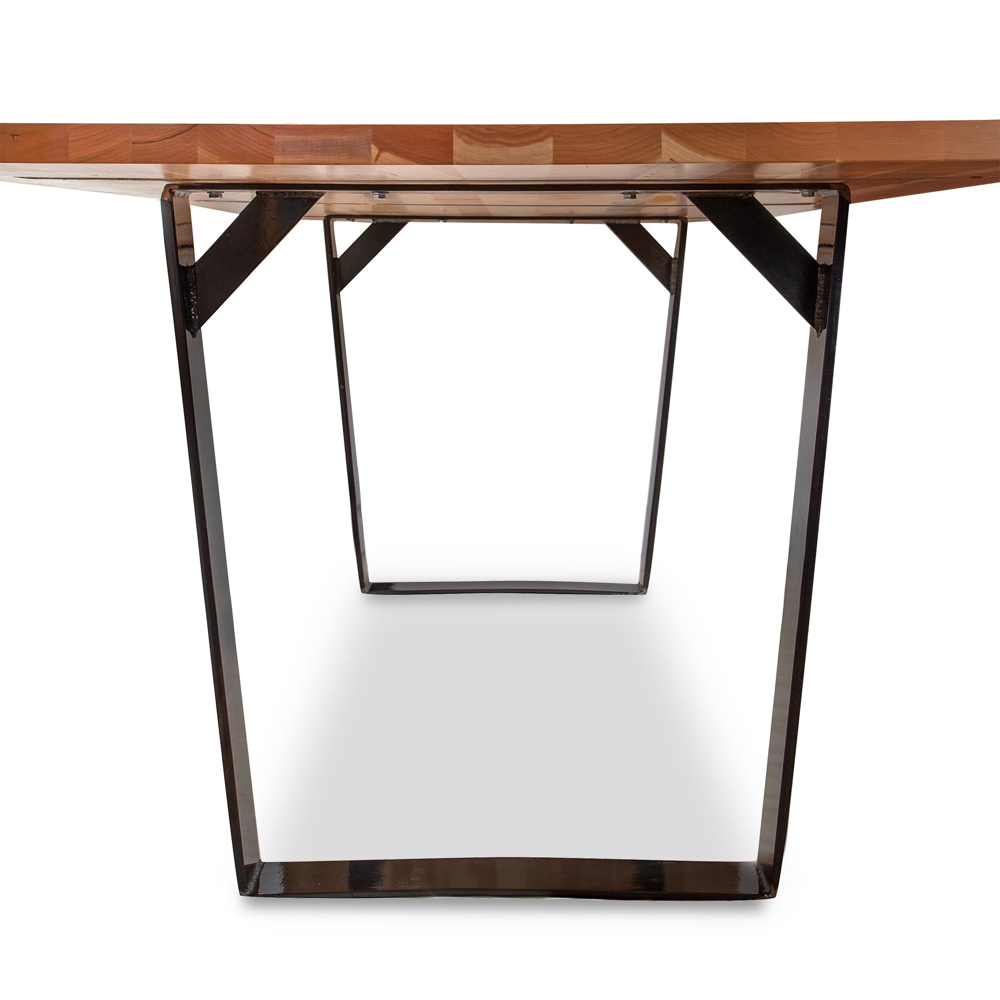 A Metropolitan Solid Top Dining Table by Lyndon Furniture, with a hardwood plank top and metal base.