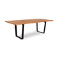 A Metropolitan Solid Top dining table by Lyndon Furniture, with a metal base and a hardwood plank top.