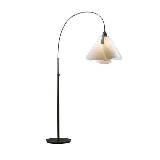 The Mobius Arc Floor Lamp, crafted by artisans at Hubbardton Forge, features a sleek black base and a stylish white shade.