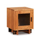 Modern American single-door nightstand by Vermont Furniture Designs with glass door, black handle, square silhouette, and sleek wooden base.