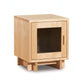 Modern American 1-Door Nightstand by Vermont Furniture Designs in light wood with glass door, sleek handle, and block legs, handcrafted in the USA.