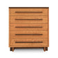 A Modern American 5-Drawer Chest from Vermont Furniture Designs with a simple, modern design featuring five horizontal drawers, each with an integrated handle. The dresser stands on four splayed legs and has a smooth, eco-friendly oil finish.