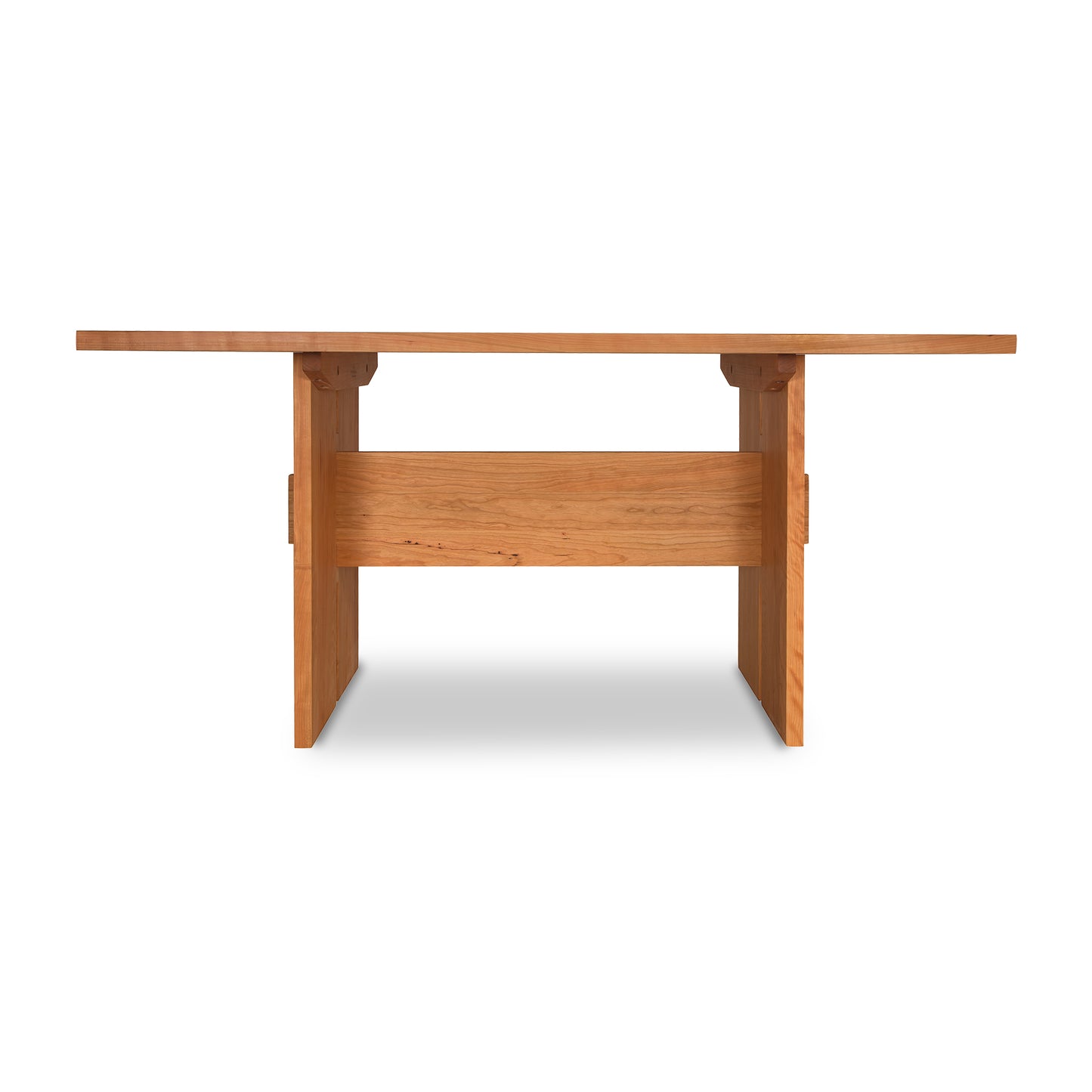 This Vermont Furniture Designs Modern American Dining Table boasts a solid wood construction, featuring a beautifully crafted wooden top.