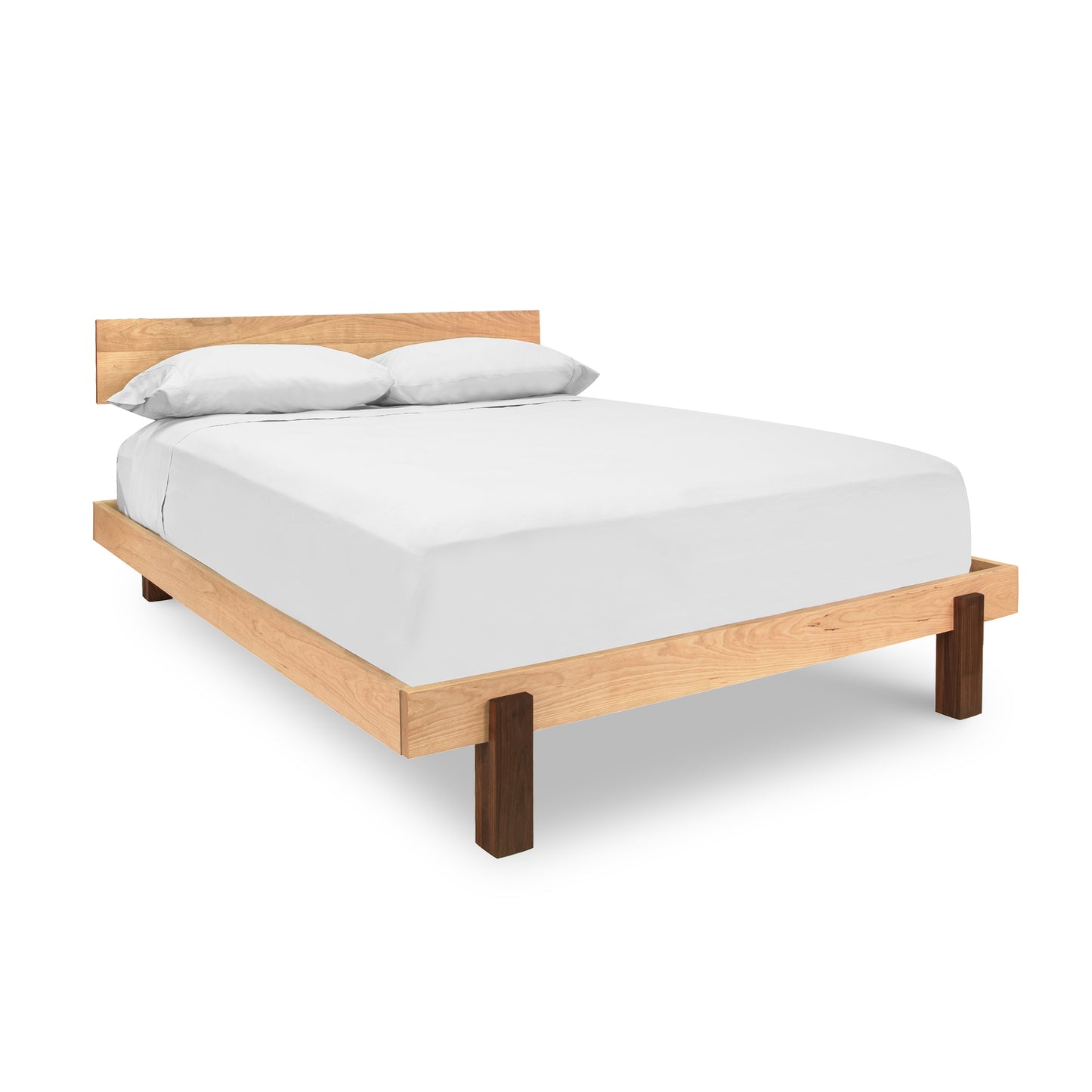 Modern American Platform Bed made of solid hardwood with a white mattress and two pillows.