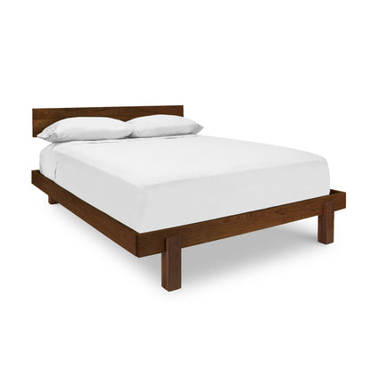 Modern American Platform Bed with white bedding and two pillows by Vermont Furniture Designs on a white background.