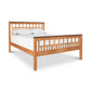 A Modern American Trellis Bed frame with a walnut wood headboard and footboard by Vermont Furniture Designs.