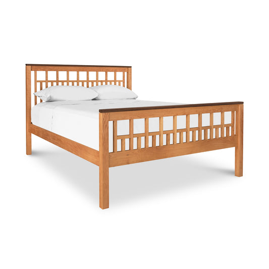 Vermont Furniture Designs Modern American Trellis Bed crafted from solid hardwoods, with a slatted headboard and footboard, furnished with white bedding, isolated on a white background.