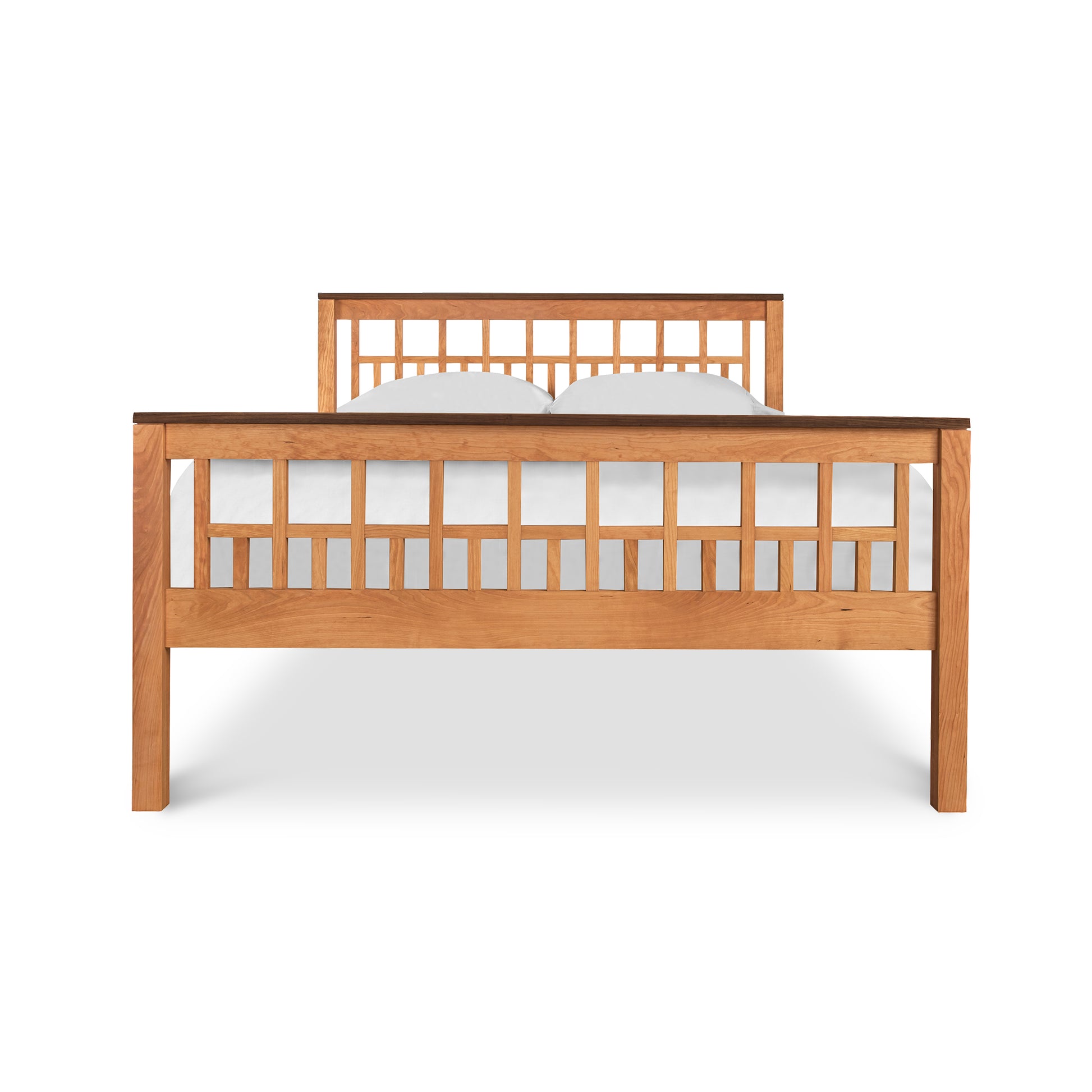 A wooden bed frame with a headboard and footboard featuring a grid-like panel design, isolated on a white background, known as the Vermont Furniture Designs Modern American Trellis Bed.