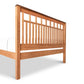 A Modern American Trellis bed frame with walnut wood slats, made by Vermont Furniture Designs.