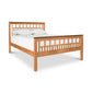 Modern American Trellis Bed by Vermont Furniture Designs with slatted headboard and footboard, shown with white mattress and pillows.
