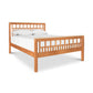 Vermont Furniture Designs Modern American Trellis Bed with grid headboard, white bedding, and two pillows, showcasing fine American craftsmanship.