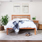 Modern American Trellis Low Footboard Bed by Vermont Furniture Designs, featuring solid wood craftsmanship with white bedding and blue plaid throw.